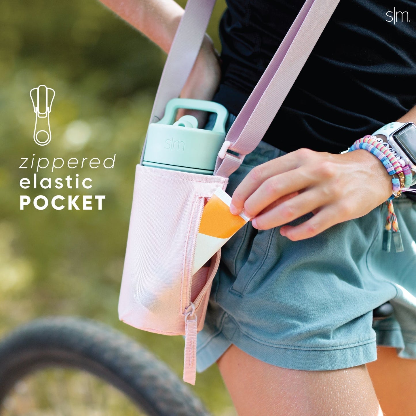 Blush pink kids sling bag with mint green water bottle and pale lavender accents, designed for adventure and outdoor activities