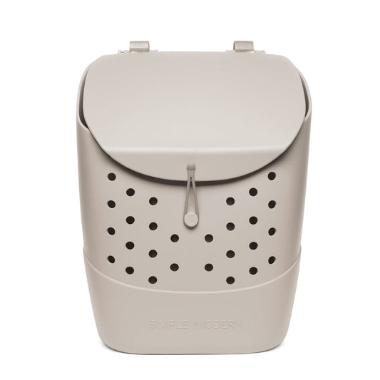 Beige cream-colored product with black circular perforations throughout, creating monochromatic design with contrast detailing